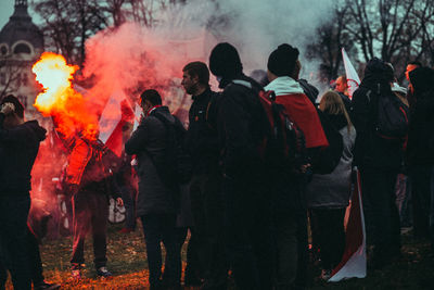 Group of people against fire