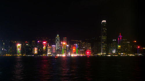 Illuminated buildings in city at night