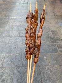 High angle view of meat on barbecue