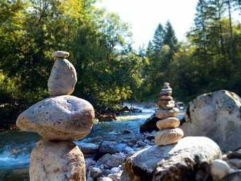 Close-up of statue against rocks in water