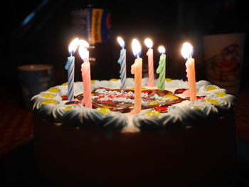 Close-up of candles on birthday cake