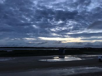 Scenic view of sea against storm clouds