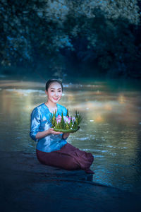 Woman sitting in a lake
