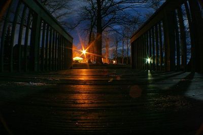 View of illuminated street lights at night