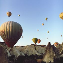 Low angle view of hot air balloons against sky