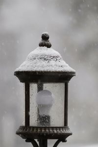 Close-up of wet snow covered metal during winter