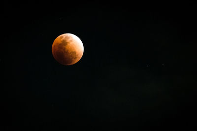 Low angle view of moon against clear sky at night