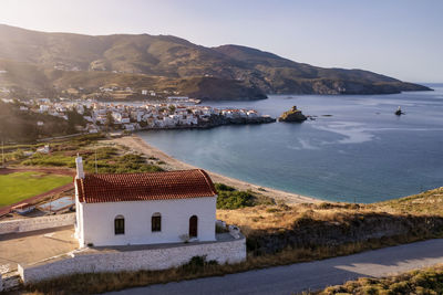 Scenic view of sea and buildings against sky