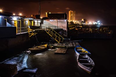 High angle view of canal in city at night