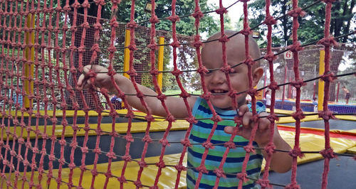 Low angle view of child playing on playground