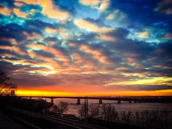 Scenic view of dramatic sky over sea during sunset