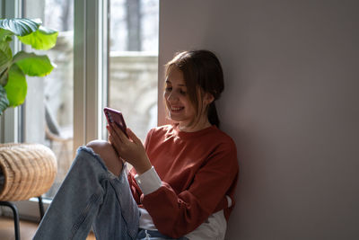 Young woman using mobile phone