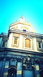 Low angle view of building against clear blue sky