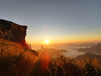 Scenic view of mountains against sky during sunset