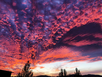 Low angle view of dramatic sky during sunset