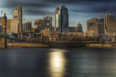 Illuminated city at waterfront