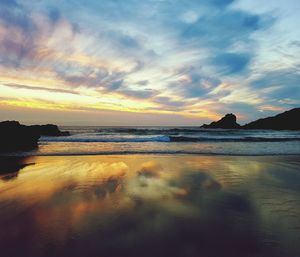 Scenic view of sea against sky during sunset