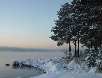 Scenic view of frozen lake against sky during winter