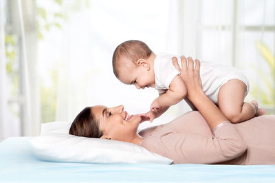 Young woman sleeping on bed at home