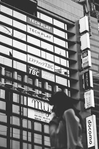 Information sign against buildings in city