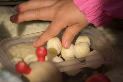 Close-up of hand holding fruits