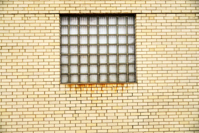 Full frame shot of window on brick wall