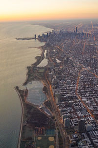 High angle view of city buildings during sunset