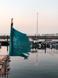 Fishing boats in harbor at sunset