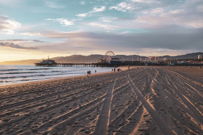 Scenic view of beach against sky during sunset