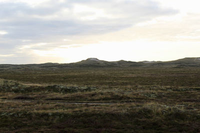 Scenic view of landscape against sky during sunset