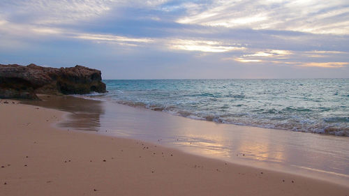 Scenic view of sea against sky at sunset