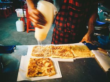 Midsection of person preparing food