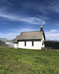 Church on field against sky