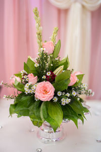 Close-up of pink flower vase on table