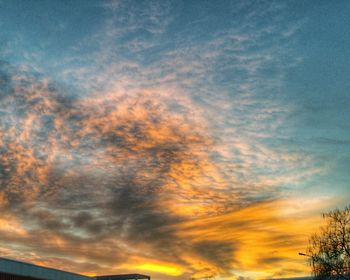 Low angle view of cloudy sky at sunset