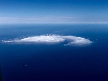 Scenic view of sea against blue sky