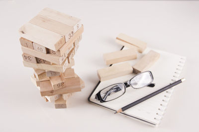 High angle view of books on table against white background