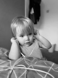 Cute girl listening music at home