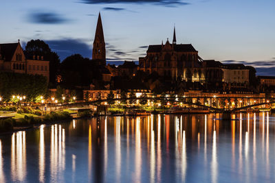 Illuminated buildings in water