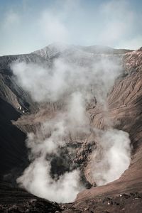 Smoke emitting from volcanic mountain