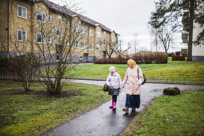 Mother with daughter walking together