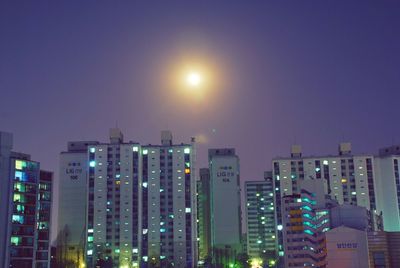 Buildings in city at night