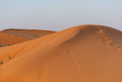 Scenic view of desert against clear sky