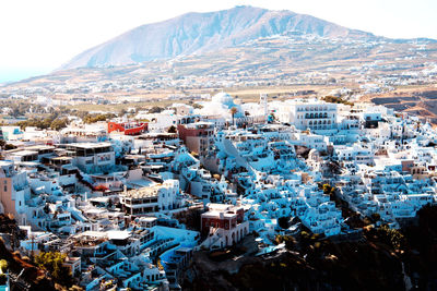 High angle view of townscape against mountain