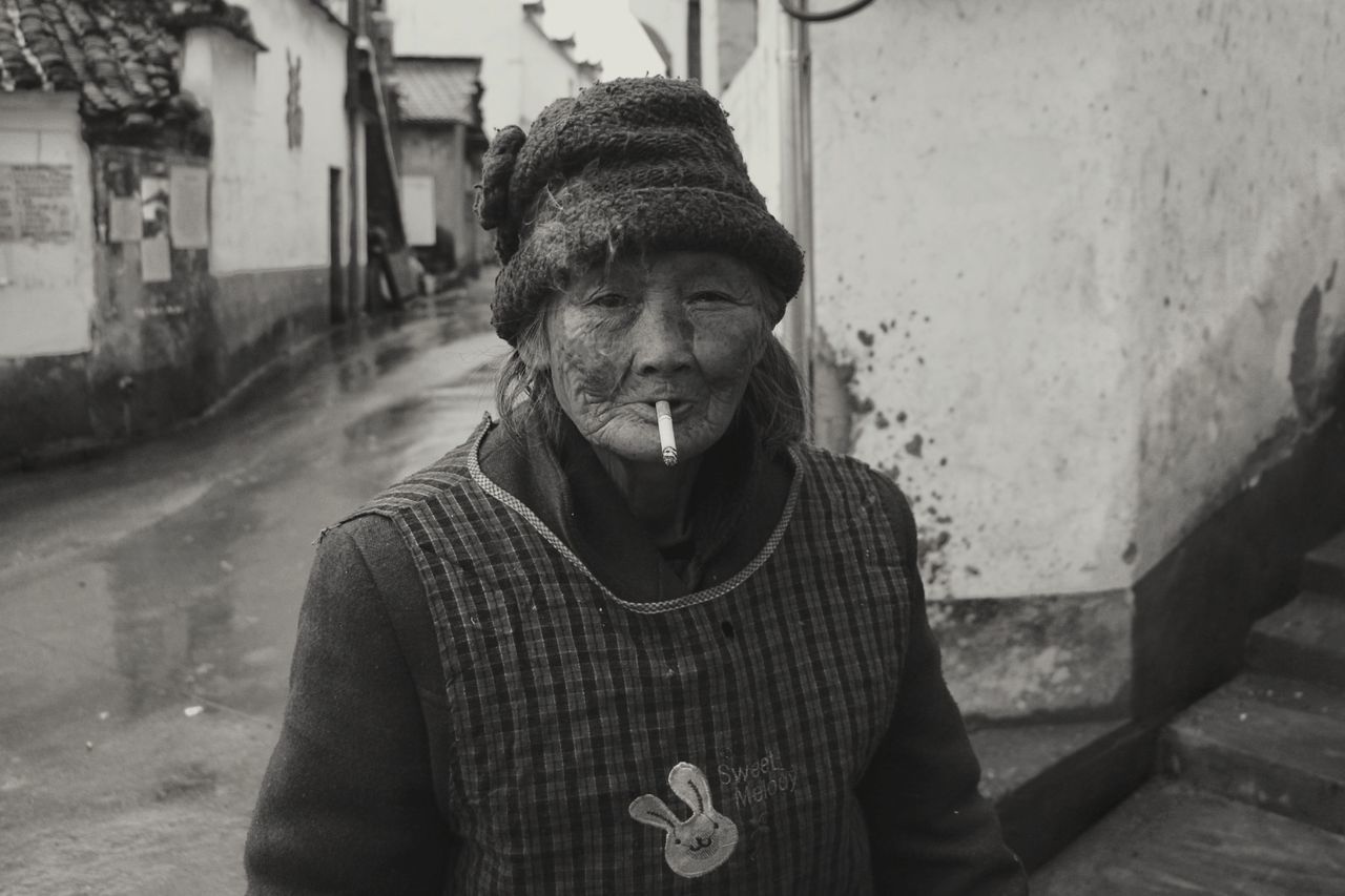 PORTRAIT OF MAN STANDING IN SNOW