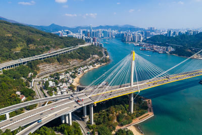High angle view of bridge and cityscape against sky