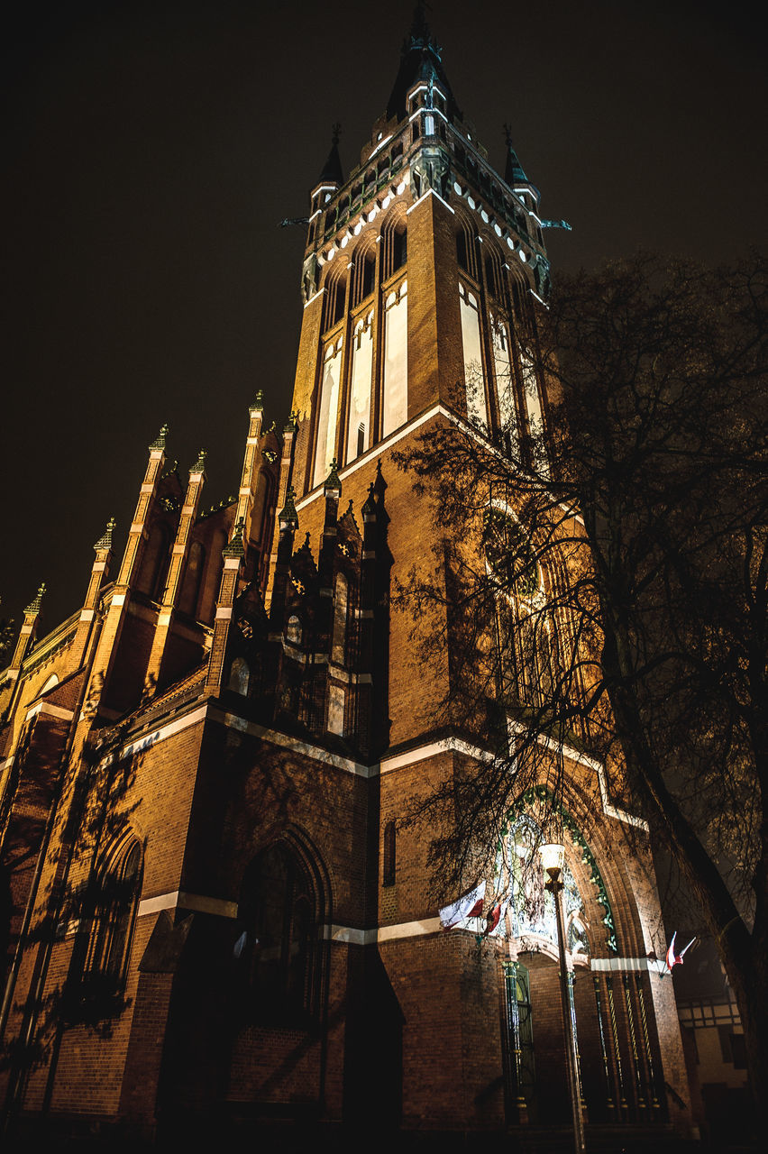 LOW ANGLE VIEW OF ILLUMINATED TEMPLE