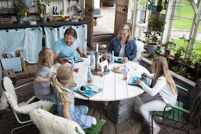 Family with three children eating dessert