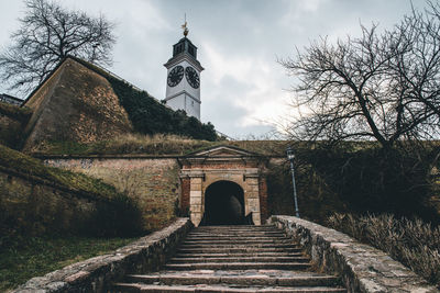 Staircase leading towards temple against building