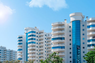 Fragments of the facades of modern multi-storey residential buildings, front view.